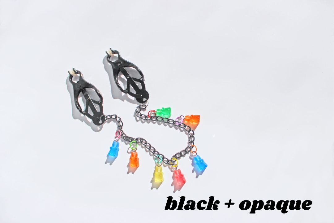 Black clover clamps with chain and multicolored opaque gummy bear charms and text reading black + opaque