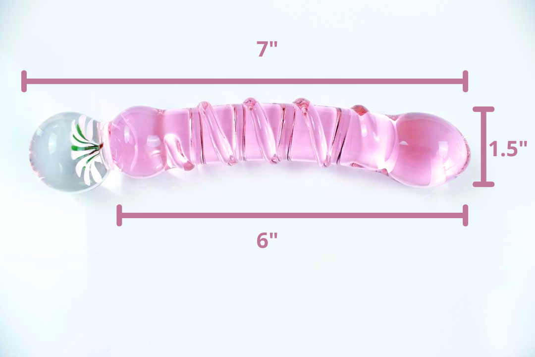 Side view of pink glass daisy dildo showing the following measurements: 7 inches total length, 6 inches insertable length, 1.5 inches diameter