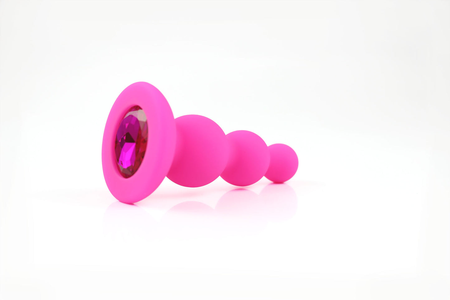 Hot pink beaded gem butt plug on a white background