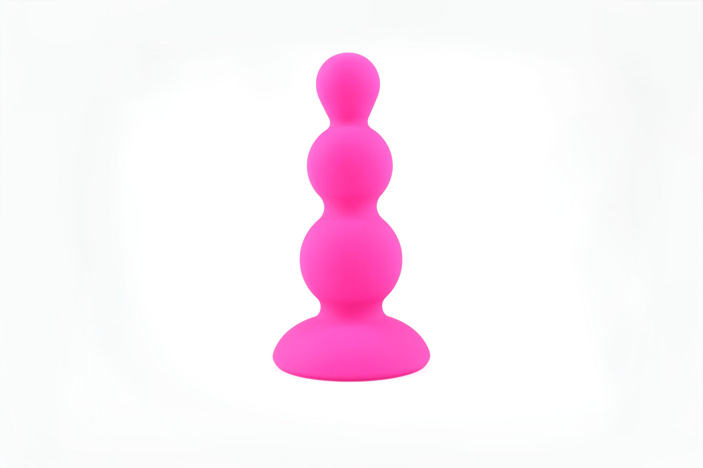 Hot pink beaded gem butt plug stood upright on its base on a white background