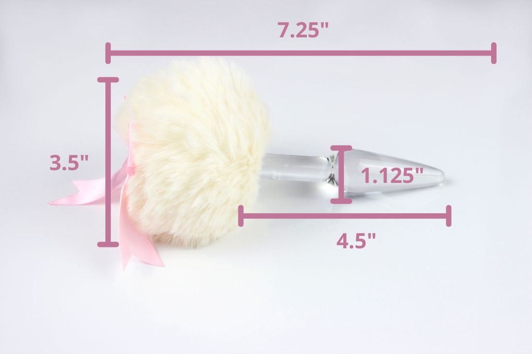 Kawaii tail plug on its side with illustrated measurements: 7.25 inch total length, 4.5 inch insertable length, 1.125 inch insertable widest diameter, 3.5 inch diameter pom tail base