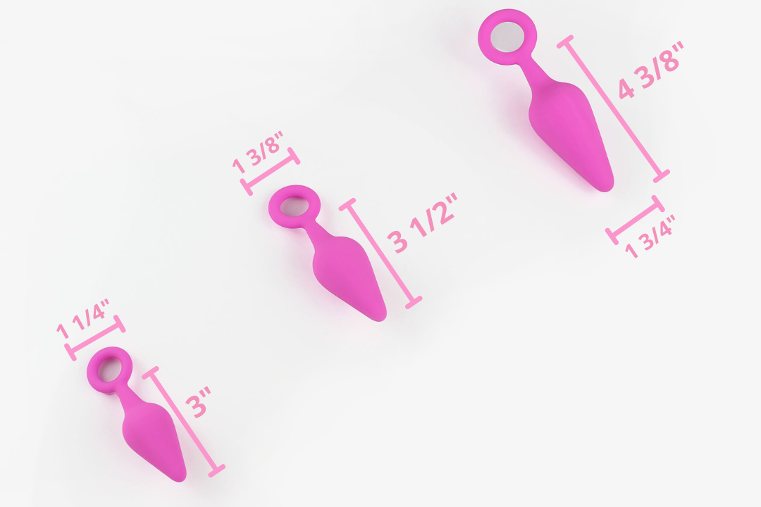 3 pink silicone anal trainers on a white background with corresponding measurements