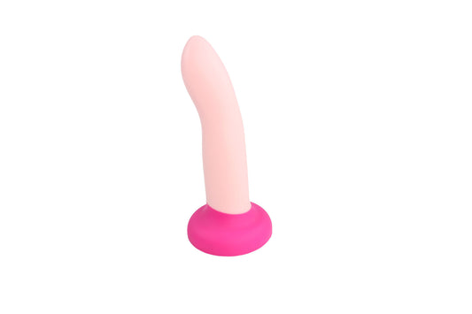 Colorblocked light pink and fuchsia dildo standing upright on a white background.