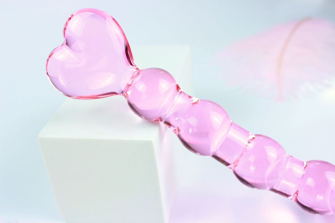 Close up of heart base on glass anal beads