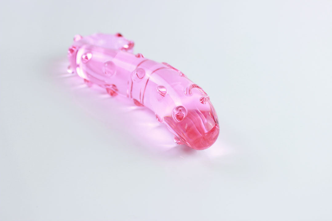 Front shot of 6.125 inch long pink tentacle dildo laid on its side