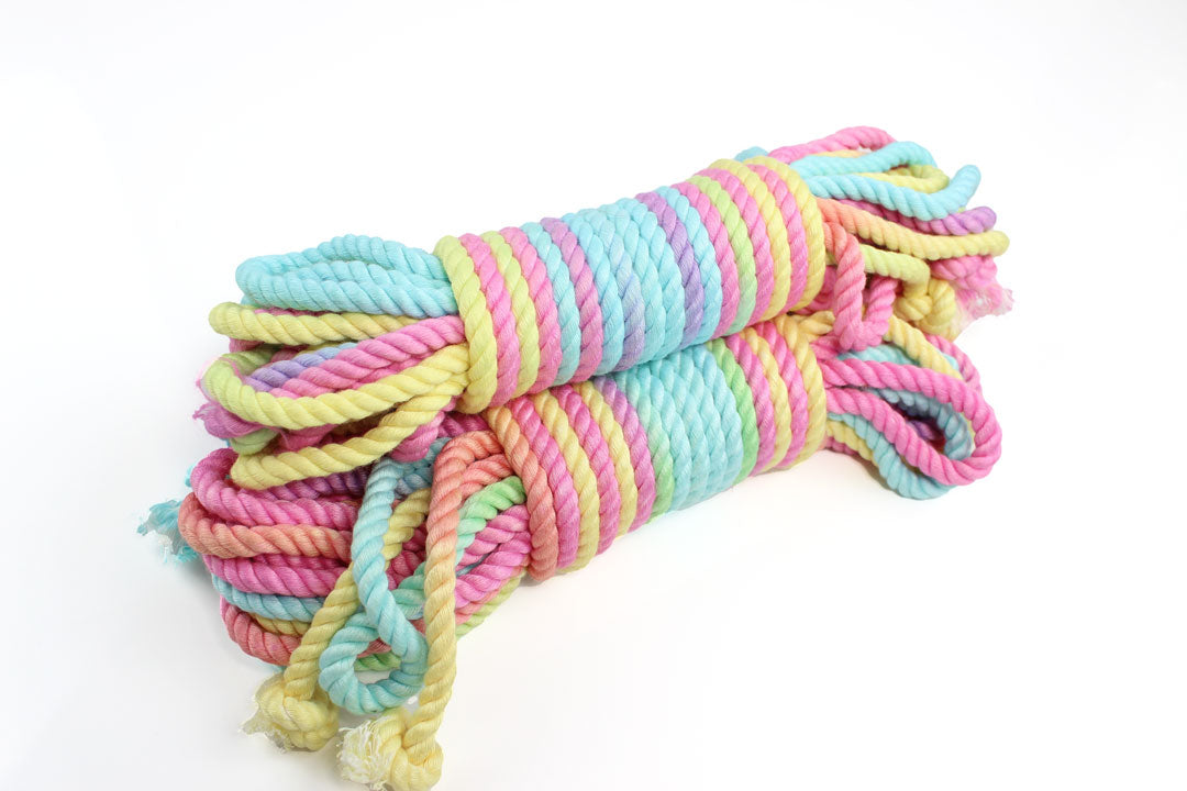 3 bundles of multicolor pastel bamboo silk shibari rope on a white background