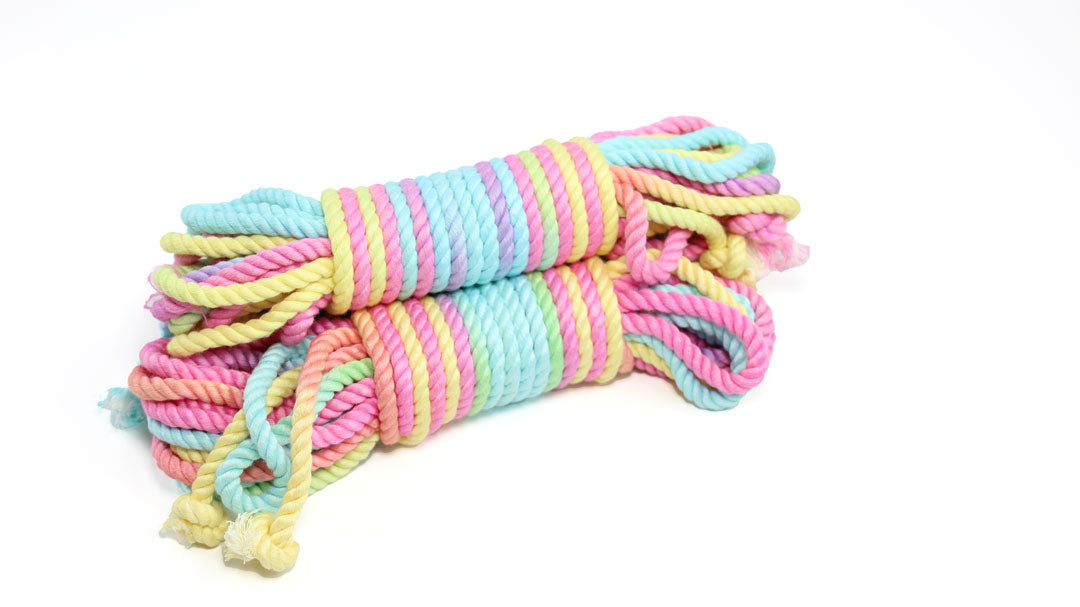 3 bundles of multicolor pastel bamboo silk shibari rope on a white background