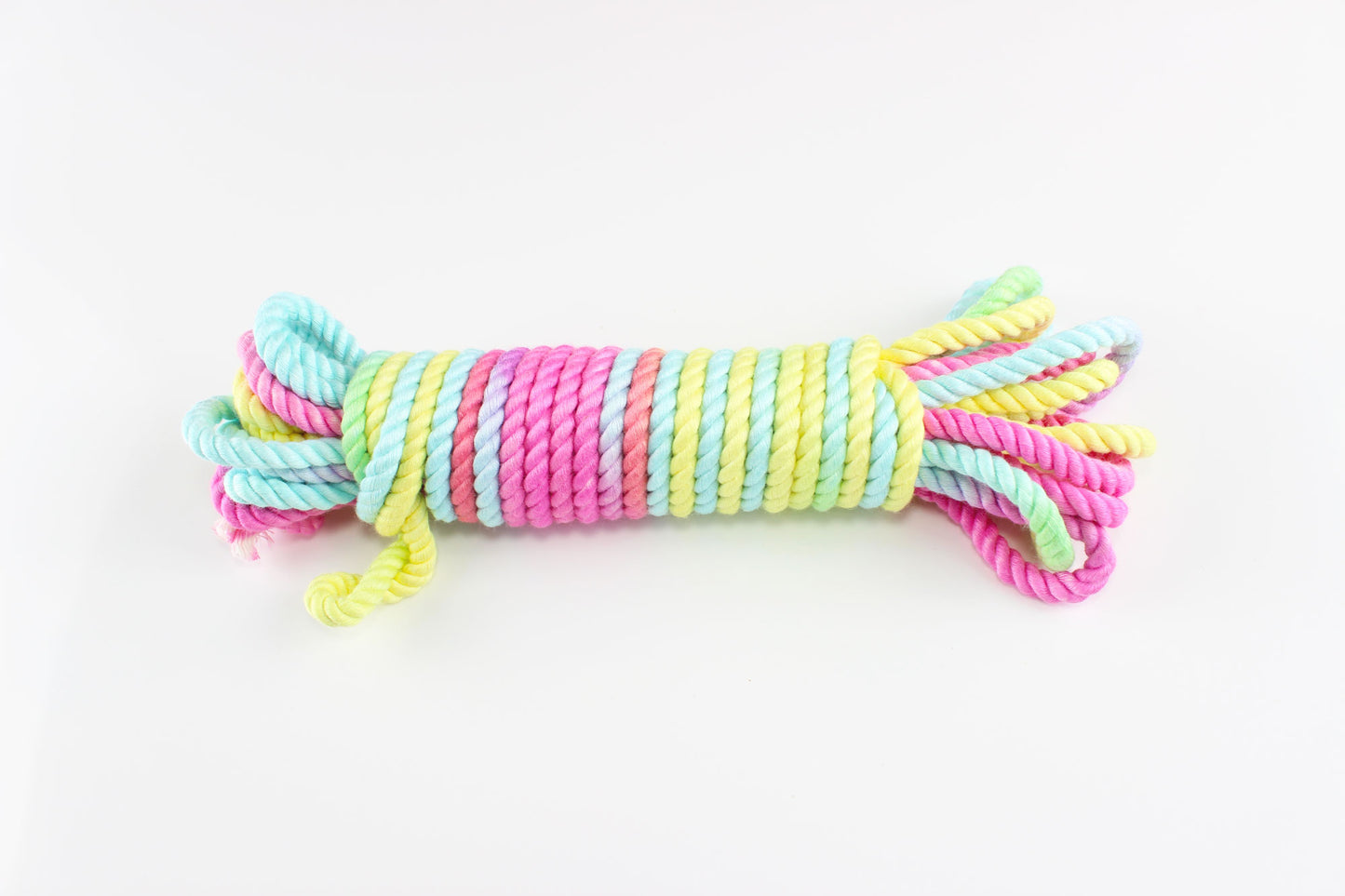 Bundle of multicolor pastel bamboo silk shibari rope on a white background