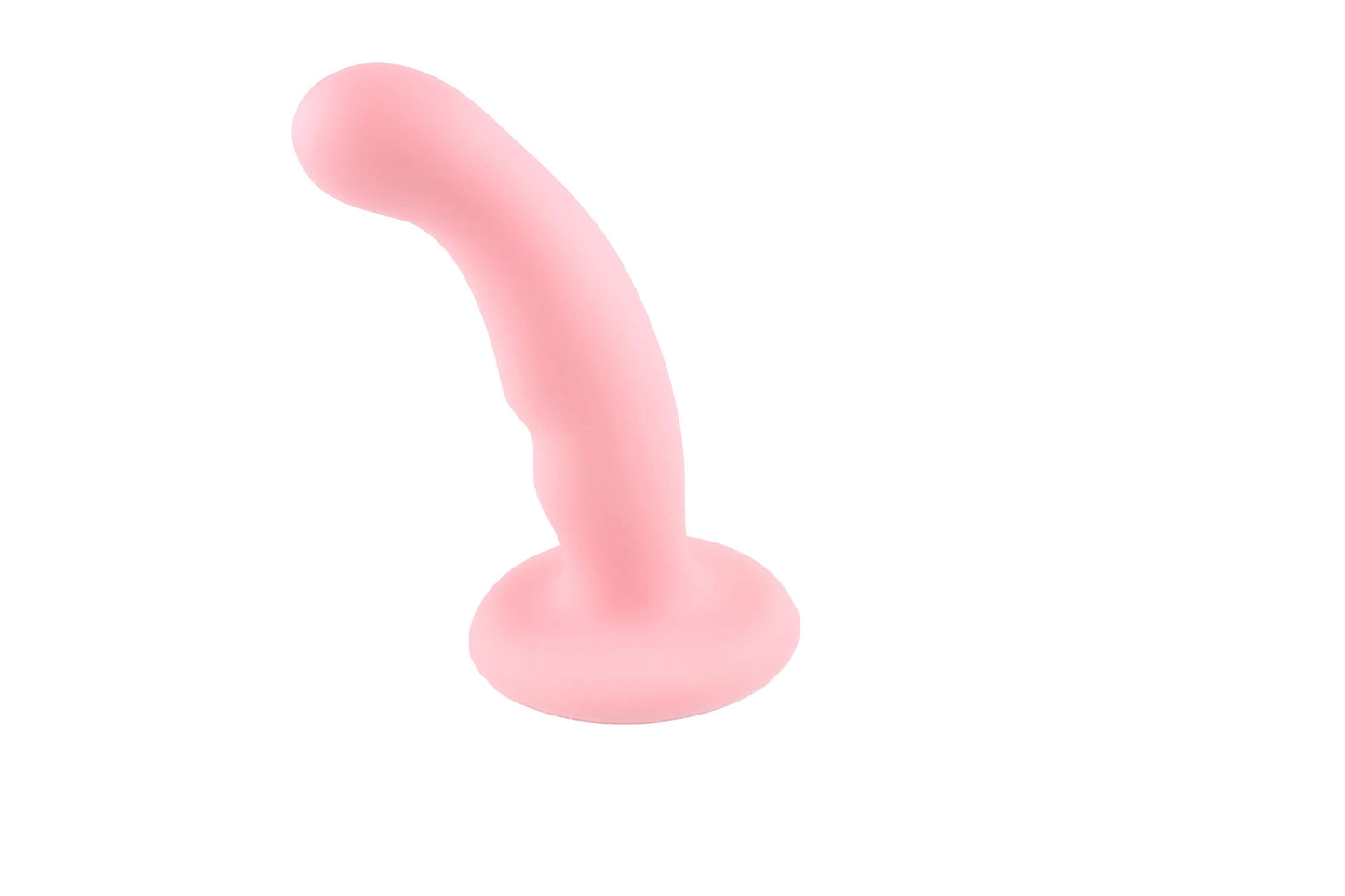 Light pink silicone dildo standing upright on white background